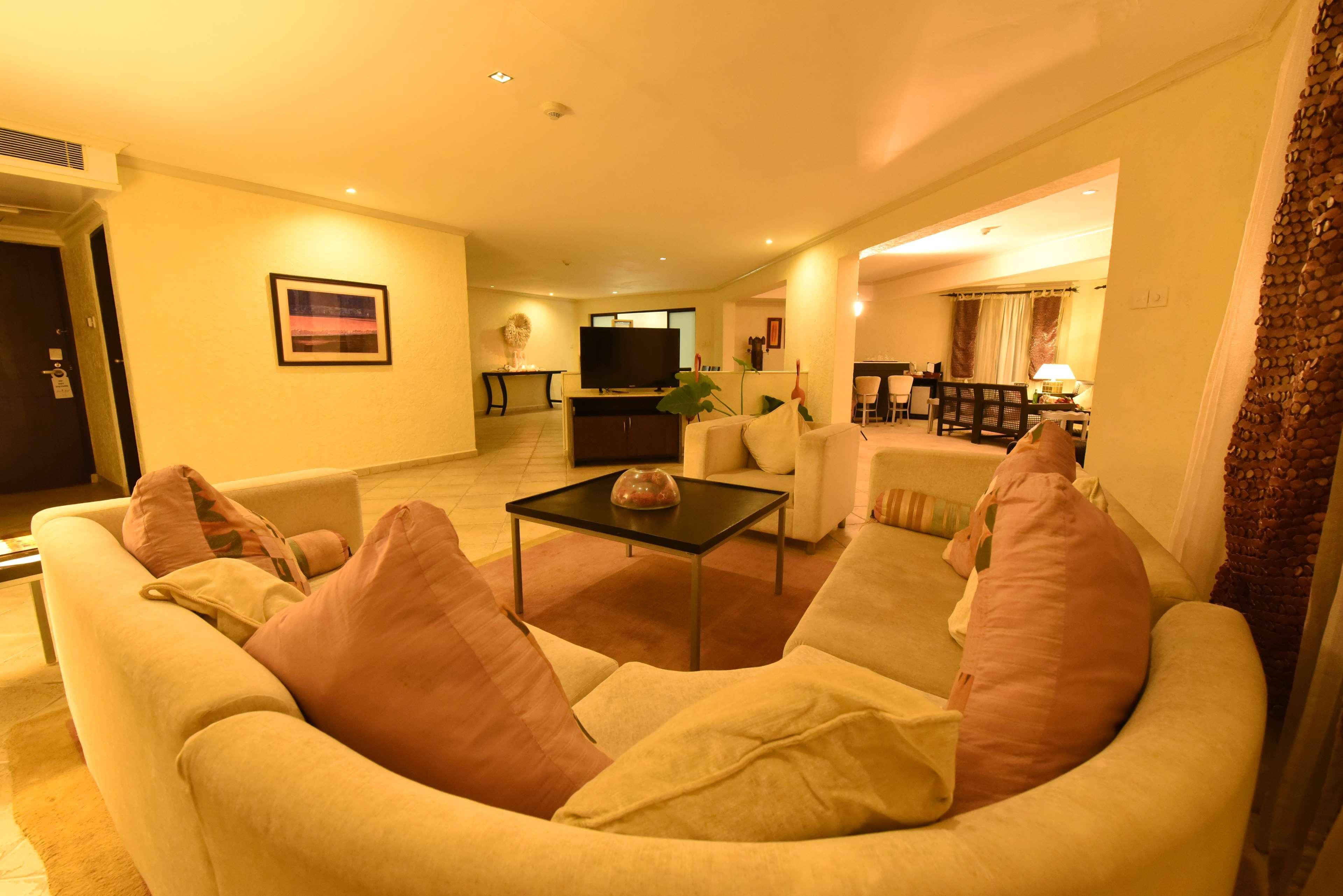 Diani Reef Beach Resort & Spa - Your Beachfront Bliss Awaits Diani Beach Esterno foto A living room in a suite at the Ritz-Carlton, Maldives