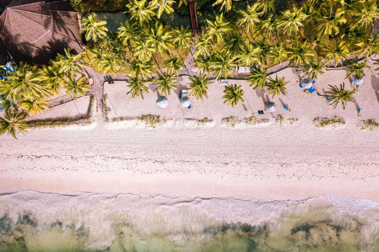 Diani Reef Beach Resort & Spa - Your Beachfront Bliss Awaits Diani Beach Esterno foto Beach at the resort