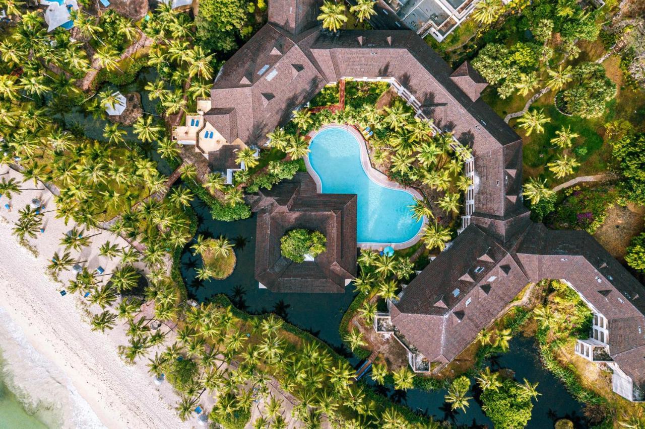 Diani Reef Beach Resort & Spa - Your Beachfront Bliss Awaits Diani Beach Esterno foto Aerial view of the resort
