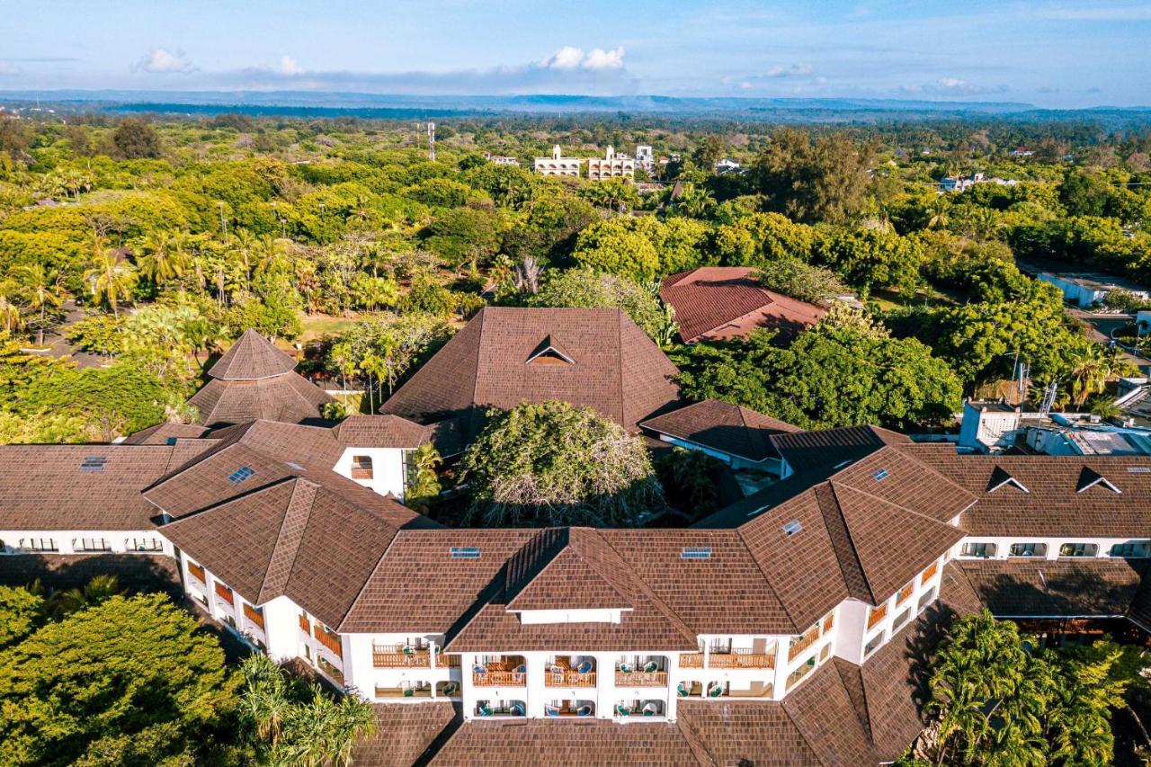 Diani Reef Beach Resort & Spa - Your Beachfront Bliss Awaits Diani Beach Esterno foto Aerial view of the hotel