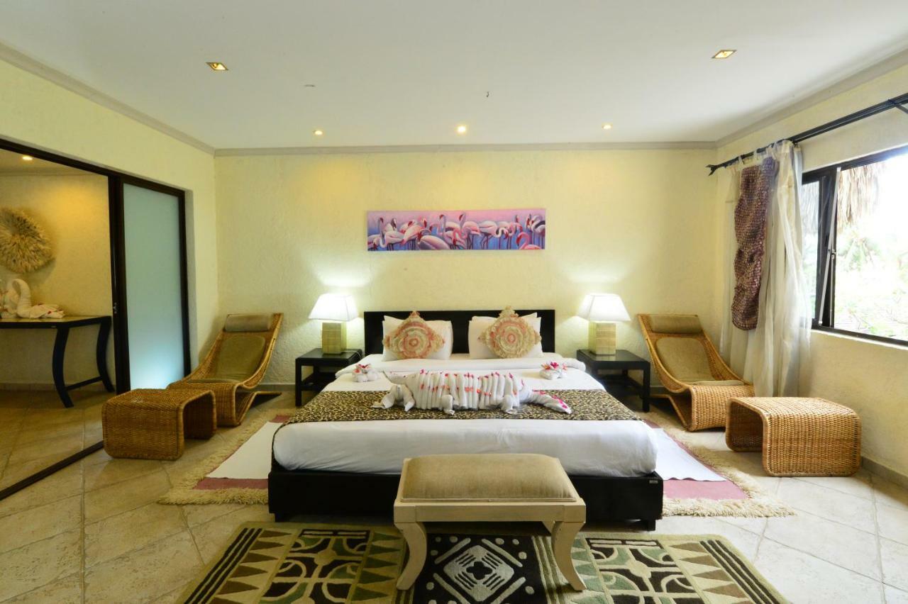 Diani Reef Beach Resort & Spa - Your Beachfront Bliss Awaits Diani Beach Esterno foto A bedroom at the resort