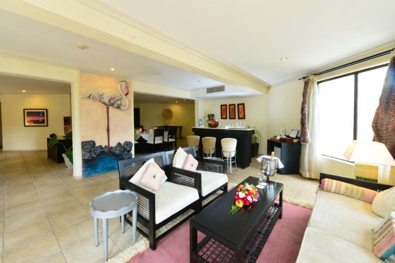Diani Reef Beach Resort & Spa - Your Beachfront Bliss Awaits Diani Beach Esterno foto A living room in a condominium