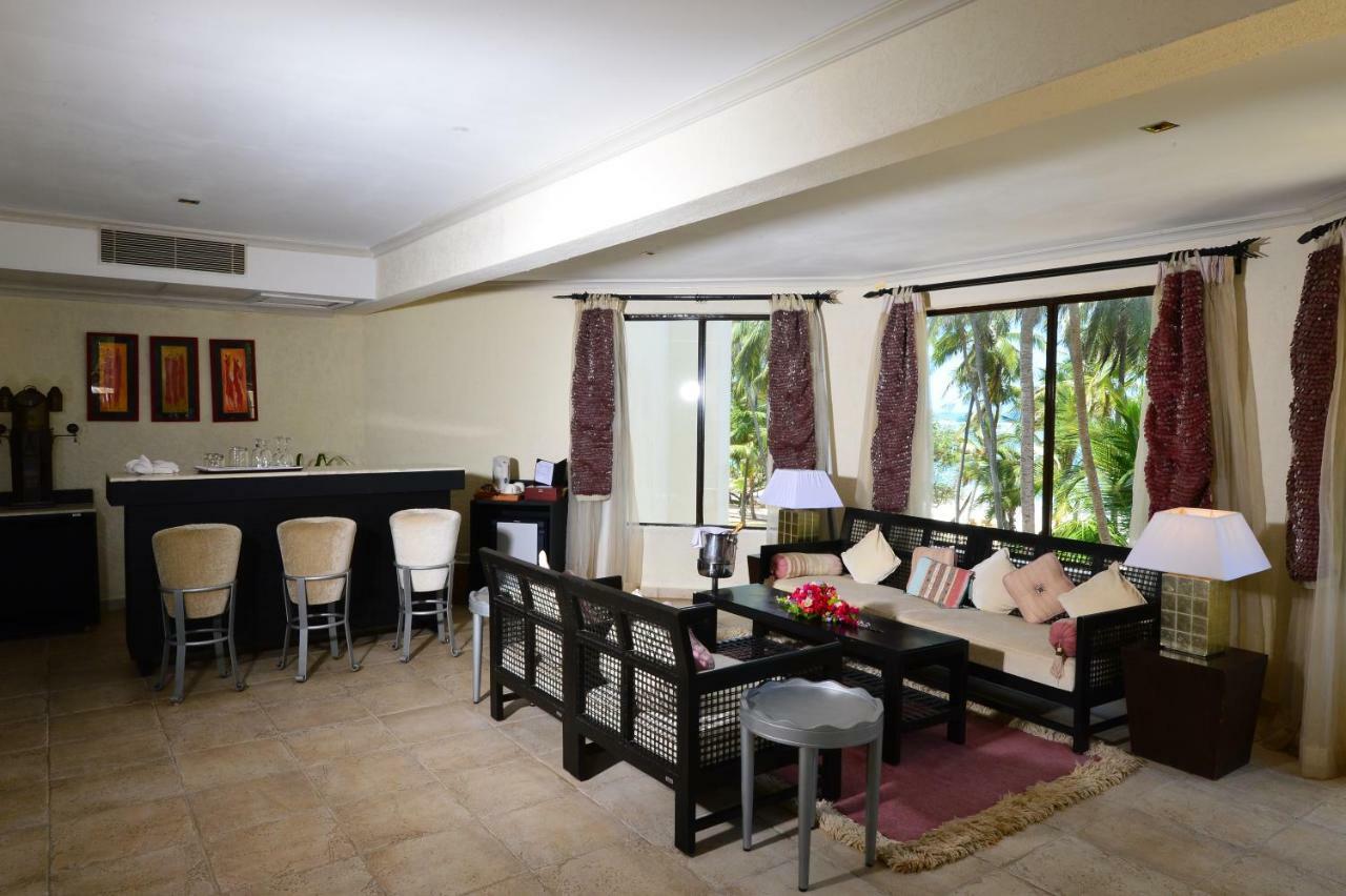Diani Reef Beach Resort & Spa - Your Beachfront Bliss Awaits Diani Beach Esterno foto A living room in a suite at the Hilton San Diego Bayfront